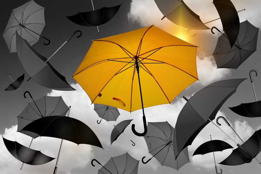 Branding - Case Study Design agency metaphor via orange umbrella amidst all grey umbrellas floating in the sky